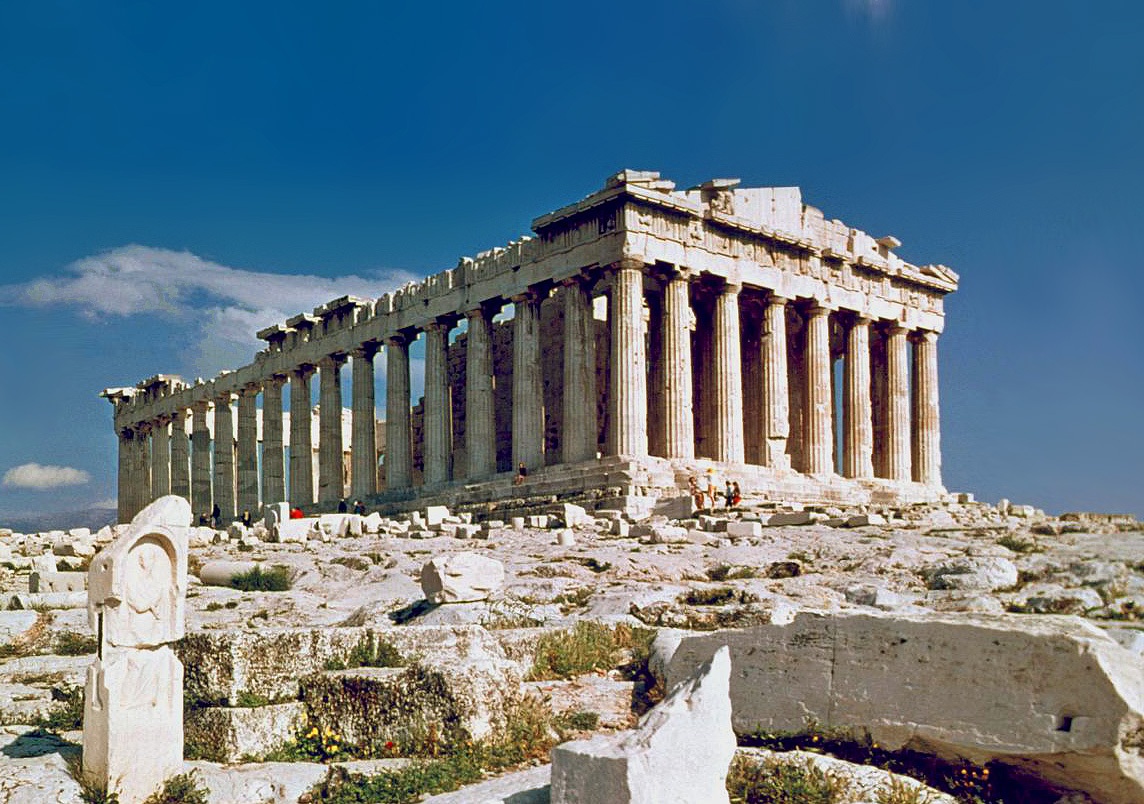 The Parthenon on the Acropolis, seen across scattered marble under a clear sky